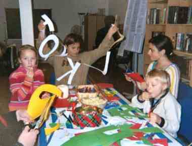 The children enjoy making holiday decorations.